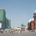 World War 2 hero Marshall Zhukov sits, astride his horse, between signs of new and old Moscow